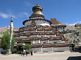 
Commissioned by a Gyantse prince in 1270, the Kumbum chorten was built in the style of a 108-sided mandala by craftsman from the Kathmandu Valley, and houses many excellent unique frescoes of Newari influence, a painting style originating in Nepal's Kathmandu Valley. It rises in eight stages to over 52m and has lots of images (Kumbum means '100,000 images') and 70 chapels. It is topped in typical Nepalese Buddhist style with the all-seeing eyes, the spire, umbrella and the pinnacle. The first five floors are four-sided, while the upper floors are circular, forming a huge three-dimensional mandala.
